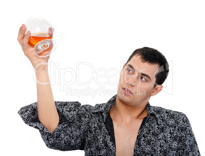 Portrait of a man with a glass of cognac