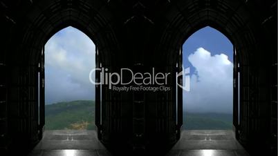 Looking through Church doors at timelapse clouds