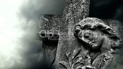 Timelapse clouds flowing past graveyard statue