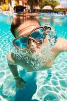 teenager floats in pool