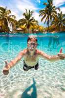 teenager floats in pool