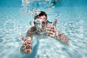 man floats in pool