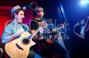 musician plays a guitar