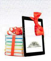 Books tied up with ribbon and tablet PC against white background
