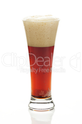 dark beer with the foam in a tall glass isolated on white