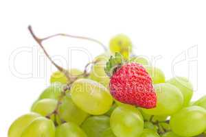 bunch of white grapes and strawberries isolated on white