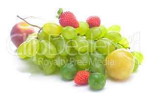 bunch of white grapes, peach and yellow plum isolated on white