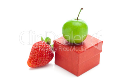 red gift box,strawberry and green plum isolated on white