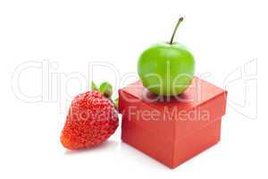 red gift box,strawberry and green plum isolated on white