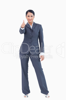 Standing businesswoman giving approval