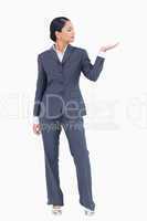 Businesswoman presenting with palm up