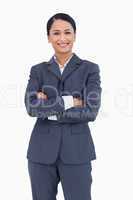 Smiling businesswoman with folded arms