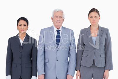 Three businesspeople standing