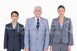 Three businesspeople standing