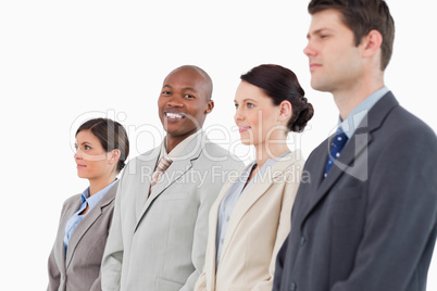 Smiling salesman standing between his colleagues