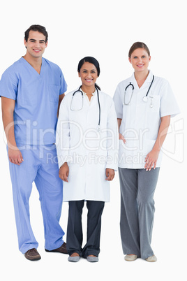 Smiling young medical staff standing together