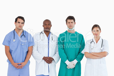 Serious looking medical team standing together