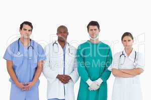 Serious looking medical team standing together