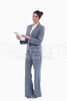 Smiling saleswoman using tablet