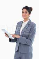 Smiling saleswoman using tablet computer