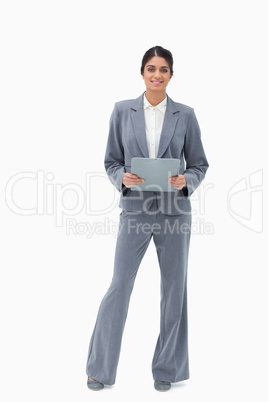 Smiling businesswoman holding clipboard
