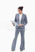 Businesswoman looking at her clipboard