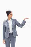 Saleswoman looking at what she is presenting in her palm