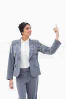 Smiling saleswoman pointing up