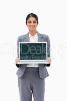 Smiling businesswoman showing her laptop