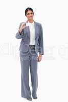 Smiling saleswoman showing blank business card