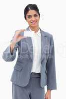 Smiling saleswoman presenting blank business card