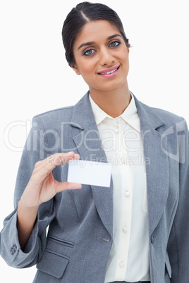 Smiling saleswoman showing her blank business card Smiling saleswoman showing her blank business card