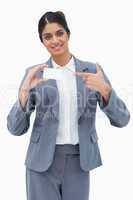 Saleswoman pointing at blank business card