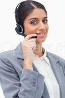 Smiling female call center agent with her headset