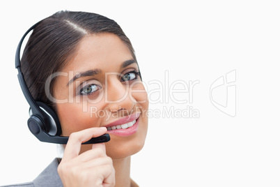 Smiling call center agent with her headset