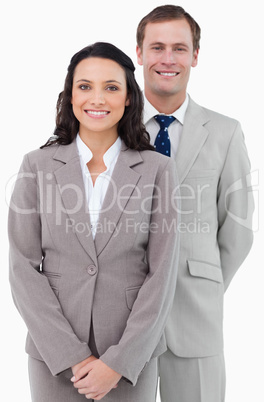 Smiling office staff standing together