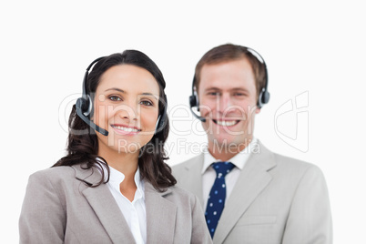 Smiling call center agents standing together