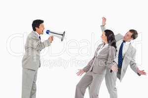 Salesman with megaphone yelling at colleagues