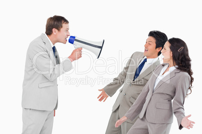 Salesman with megaphone shouting at associates