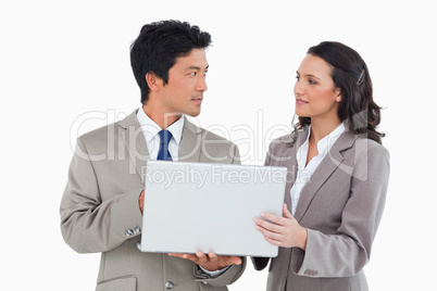 Salesteam working on laptop together