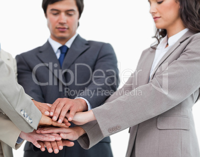 Hands of salespeople together