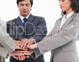 Hands of salespeople together