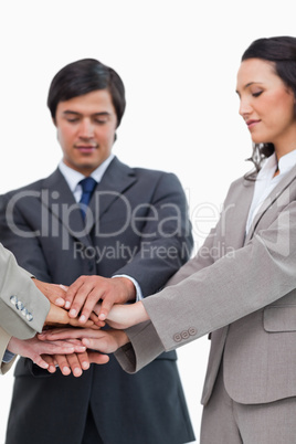 Hands of businesspeople forming a pile