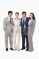 Smiling young salespeople standing together