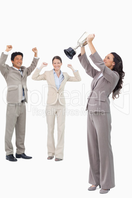 Victorious businesswoman with cup