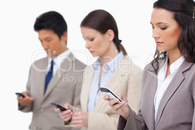 Businessteam looking at their cellphones