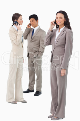 Businesspeople on their phones