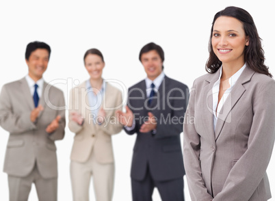 Saleswoman getting applause from her colleagues