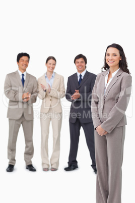 Businesswoman getting applause by her colleagues