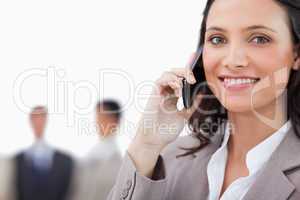 Smiling saleswoman talking on the phone